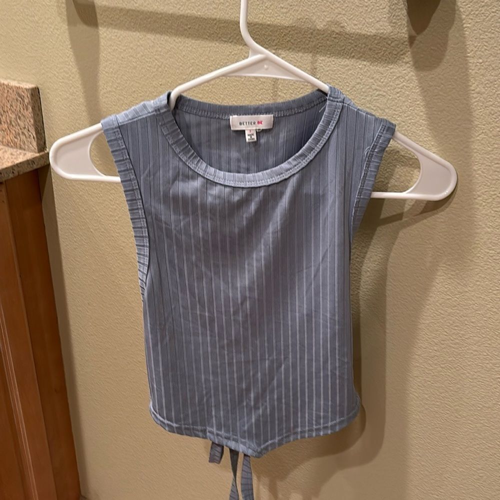 Better Be woman's silky baby blue striped shirt with a cut out in the back